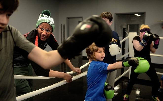 Tim Witherspoon Jr coaching young members at Witherspoon Boxing