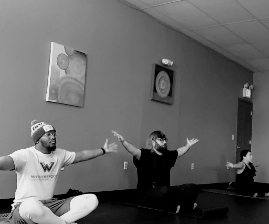 Coach holding pads during boxing personal training